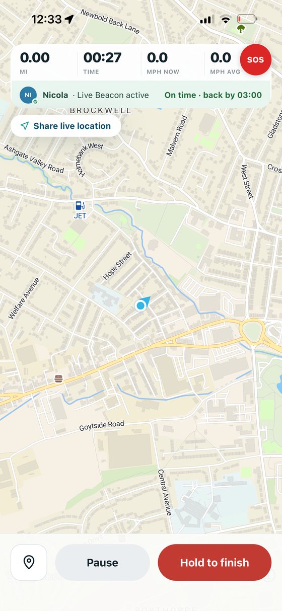A paddle being recorded: distance, elapsed time and speed across the top, an active Live Beacon and float plan, the live map below, and pause and hold-to-finish controls.